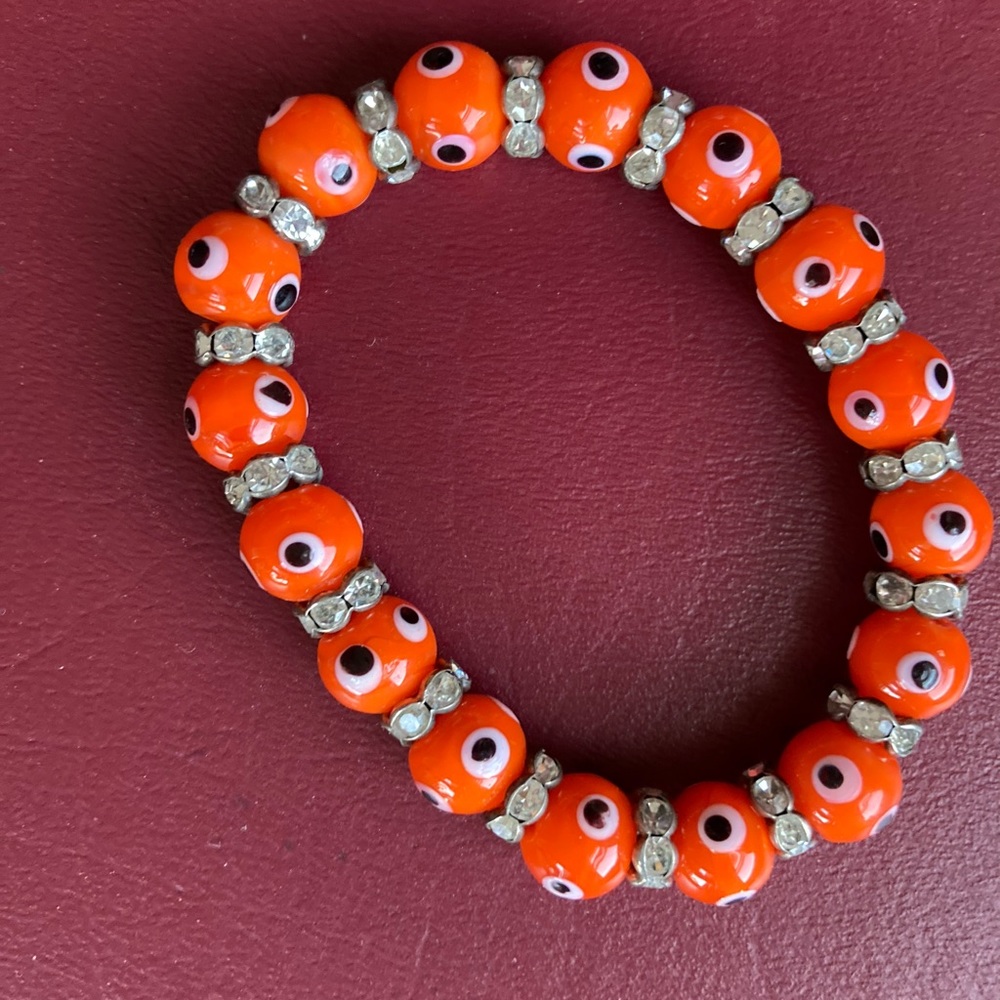 NWOT Orange “The eye” size small Bracelets